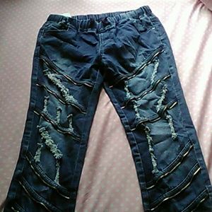 Blue jeans with rips and zippers
